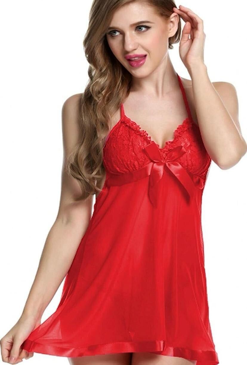 Woman wearing a red satin nightgown on a white background