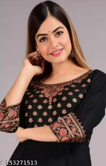 Black dress with patterned sleeves and hem on a gray background