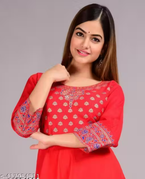 Red dress with intricate patterns on a gray background