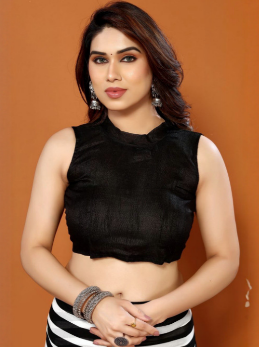 Woman wearing a black sleeveless top against an orange background