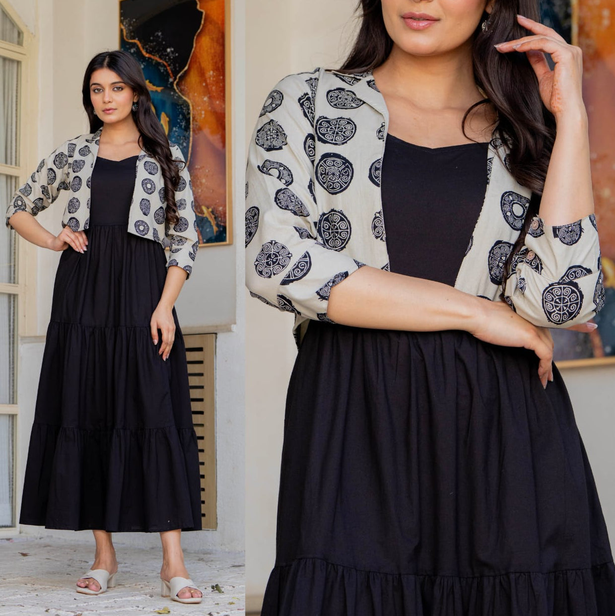 Woman wearing a black dress with a patterned cardigan indoors.