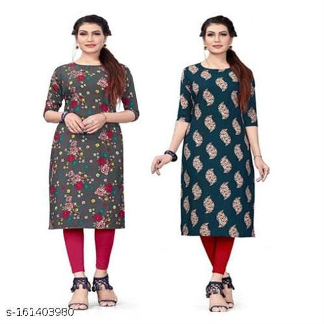 Two women wearing floral kurtis on a white background