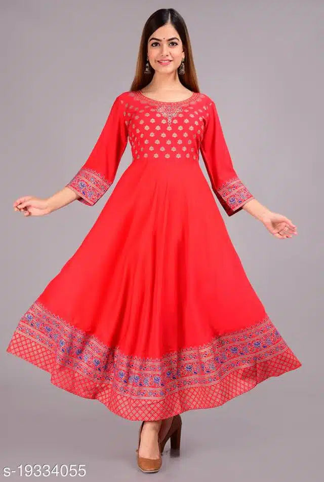 Red dress with intricate patterns on a gray background