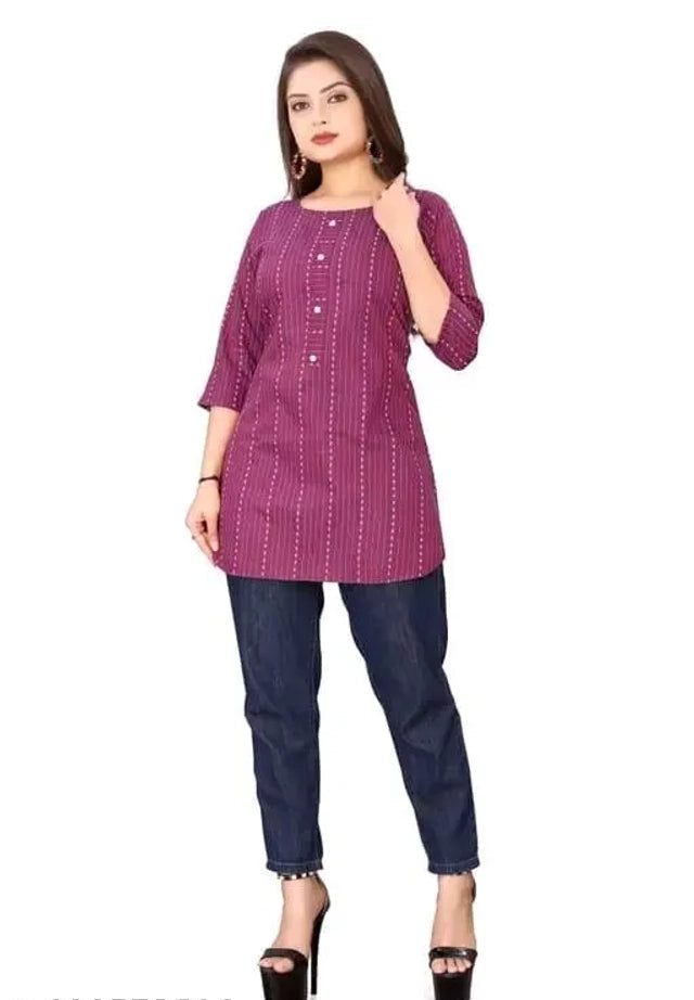Woman wearing a purple kurta with a white background