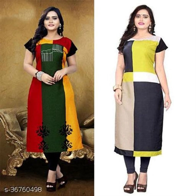 Two women wearing color-blocked kurtis with a gold sofa in the background.