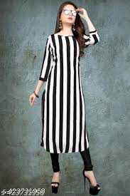 Woman wearing a black and white striped kurta on a gray background