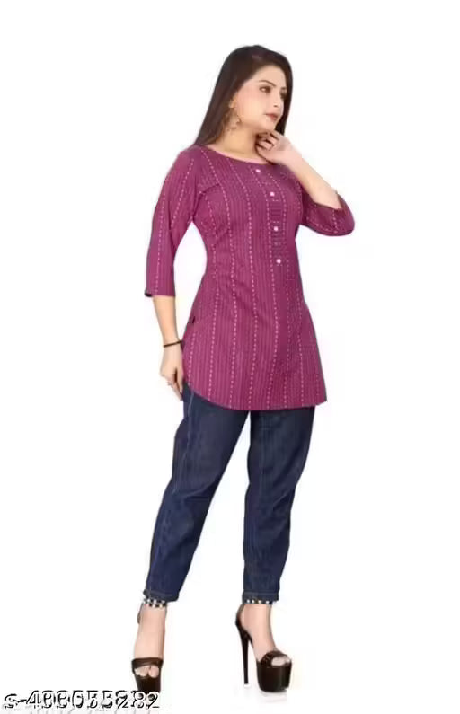 Woman wearing a purple kurta with a white background